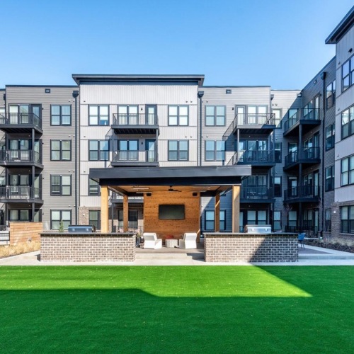 Find your perfect fit at Founder's Park a large building with a green lawn