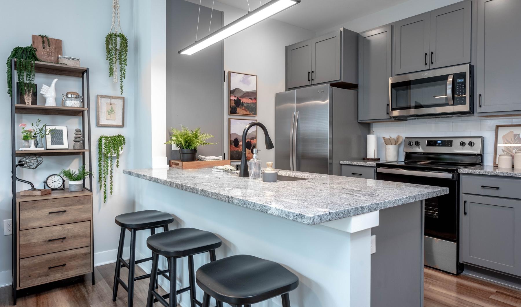 a kitchen with a bar stool and a counter top