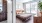 a bedroom with a bed and a desk