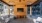 a room with a brick patio and a brick patio with a brick patio and a large screen and