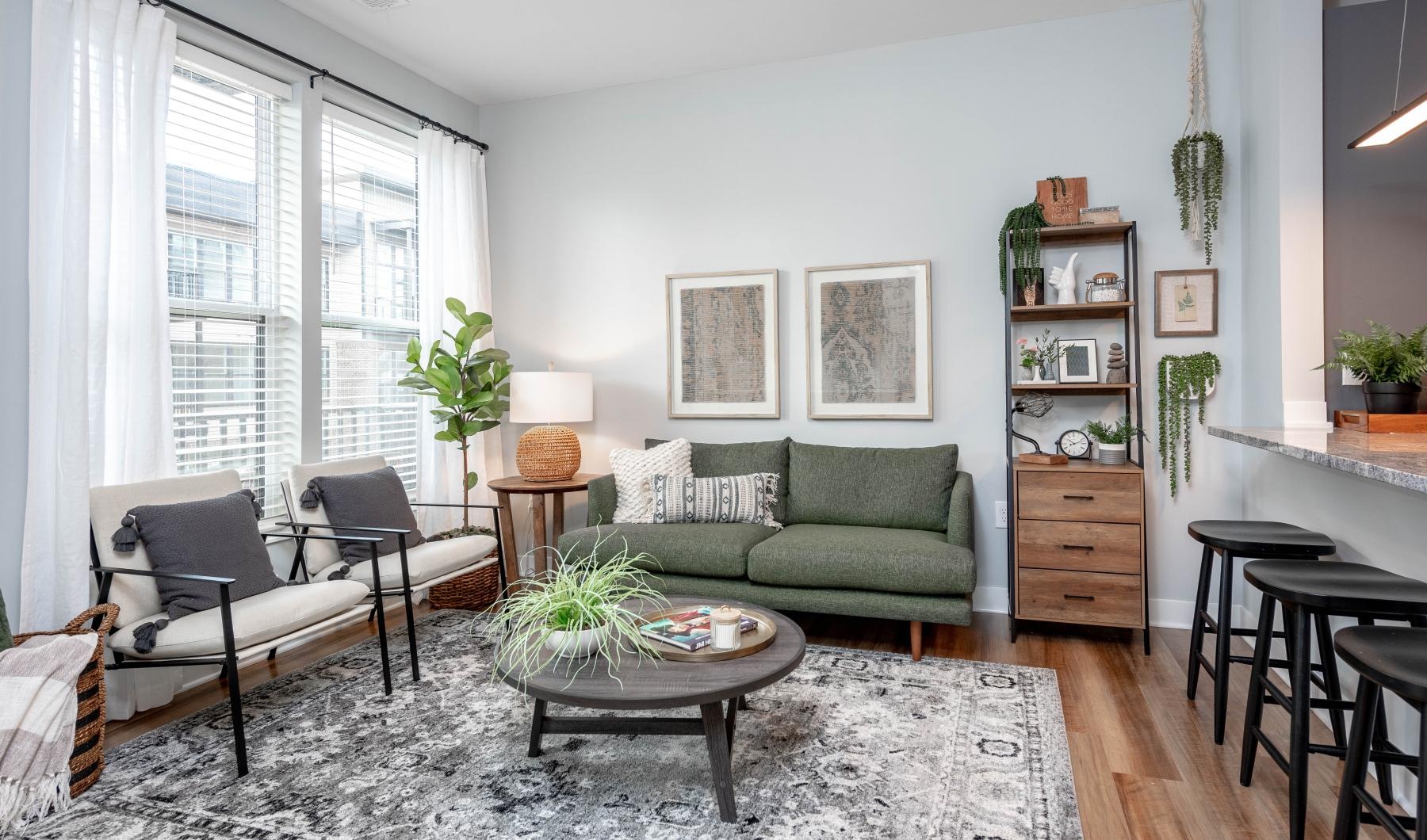 The essence of exceptional living a living room with a green couch and a coffee table