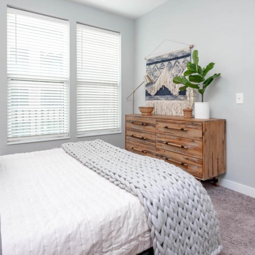 Bedroom options to fit every lifestyle a bedroom with a bed and a dresser