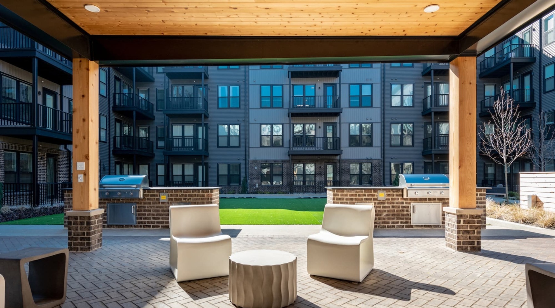 Located in Harrison West outside seating near lush green turf